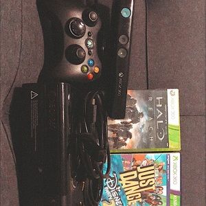 Used- Black Xbox 360 E comes with extra